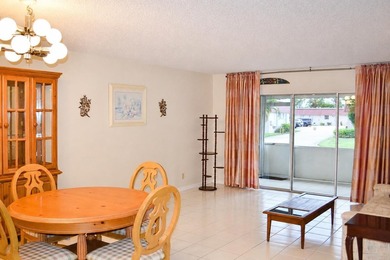Welcome to this desirable 55+ community End-unit villa in the - photo 9