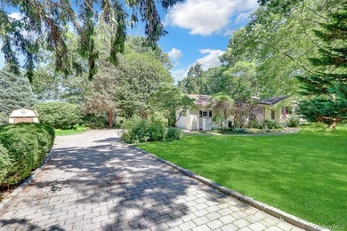 Tucked on a sprawling .57-acre canvas of park-like grounds, this - photo 1