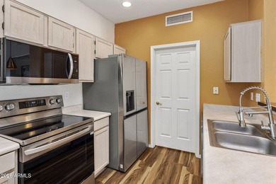 Beautifully maintained second-floor condo in the highly - photo 4
