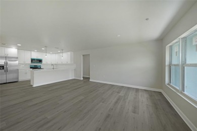 This nearly completed WATERFRONT TRIPLEX in Rotonda West, FL, is