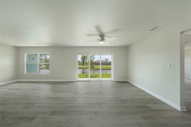 This nearly completed WATERFRONT TRIPLEX in Rotonda West, FL, is