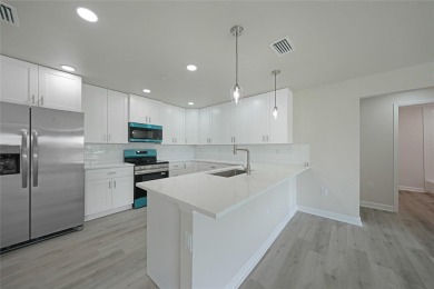 This nearly completed WATERFRONT TRIPLEX in Rotonda West, FL, is