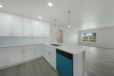 This nearly completed WATERFRONT TRIPLEX in Rotonda West, FL, is