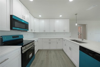 This nearly completed WATERFRONT TRIPLEX in Rotonda West, FL, is