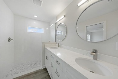 This nearly completed WATERFRONT TRIPLEX in Rotonda West, FL, is