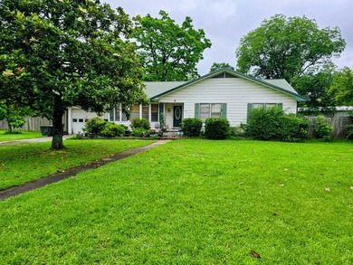 Welcome to this inviting 3-bedroom, 2-bath home located in a - photo 1