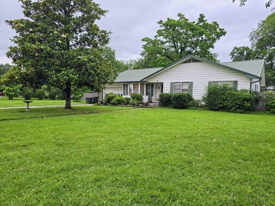 Welcome to this inviting 3-bedroom, 2-bath home located in a - photo 2