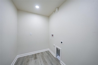 This nearly completed WATERFRONT TRIPLEX in Rotonda West, FL, is