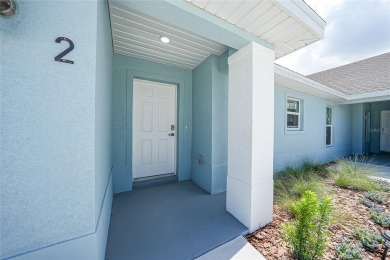 This nearly completed WATERFRONT TRIPLEX in Rotonda West, FL, is