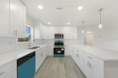 This nearly completed WATERFRONT TRIPLEX in Rotonda West, FL, is