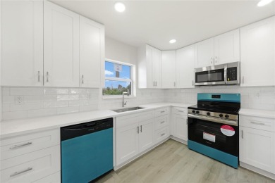 This nearly completed WATERFRONT TRIPLEX in Rotonda West, FL, is