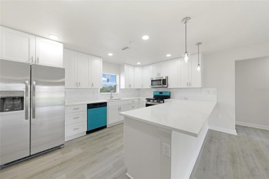 This nearly completed WATERFRONT TRIPLEX in Rotonda West, FL, is