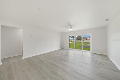 This nearly completed WATERFRONT TRIPLEX in Rotonda West, FL, is