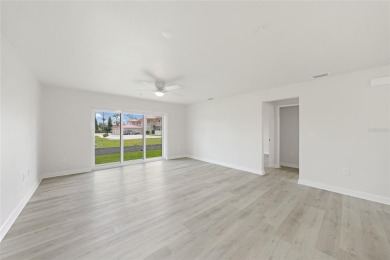 This nearly completed WATERFRONT TRIPLEX in Rotonda West, FL, is