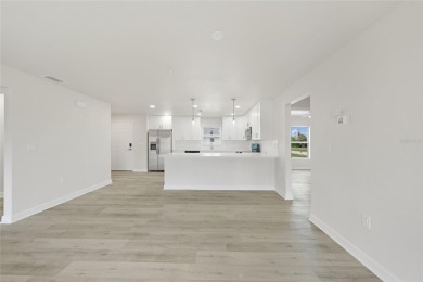 This nearly completed WATERFRONT TRIPLEX in Rotonda West, FL, is