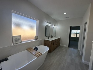 Another stunning creation by Deluxe Custom Homes! This 4-bedroom - photo 9