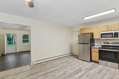 Tucked away on just over an acre in a private, wooded setting - photo 11
