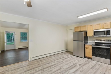 Tucked away on just over an acre in a private, wooded setting - photo 12
