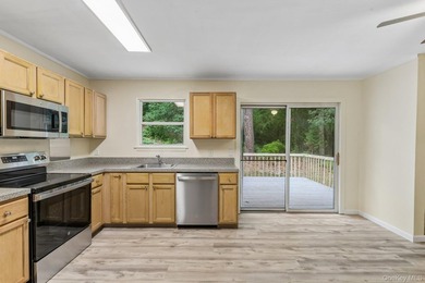 Tucked away on just over an acre in a private, wooded setting - photo 14