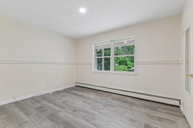 Tucked away on just over an acre in a private, wooded setting - photo 19