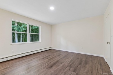 Tucked away on just over an acre in a private, wooded setting - photo 21
