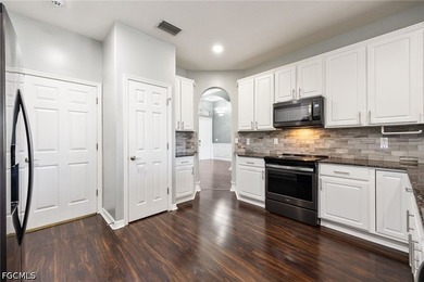 The spacious, open-concept floor plan features two living areas - photo 5