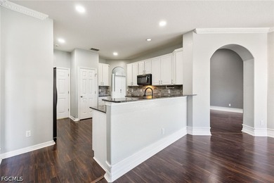The spacious, open-concept floor plan features two living areas - photo 6