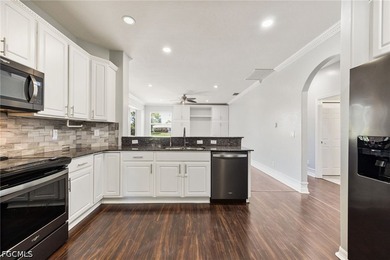 The spacious, open-concept floor plan features two living areas - photo 7