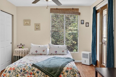 Nestled on a beautifully landscaped, fairly level lot surrounded - photo 8