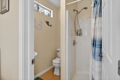 Nestled on a beautifully landscaped, fairly level lot surrounded - photo 9