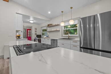 A quiet ranch wrapped in mature trees, soft natural light, and a - photo 3