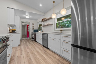 A quiet ranch wrapped in mature trees, soft natural light, and a - photo 5