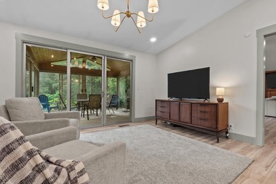A quiet ranch wrapped in mature trees, soft natural light, and a - photo 8