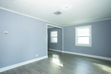 Home is move-in ready! This spacious 4-bedroom, 2-bath - photo 4