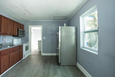 Home is move-in ready! This spacious 4-bedroom, 2-bath - photo 7