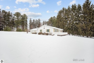 Lake Home For Sale in Rapid City, Michigan