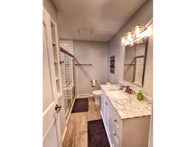 Lake life just got an upgrade. This remodeled waterfront home at - photo 17