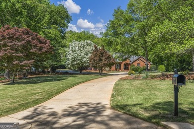 Welcome to this stunning four-sided brick lakefront retreat - photo 3