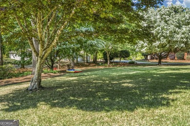 Welcome to this stunning four-sided brick lakefront retreat - photo 4