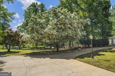 Welcome to this stunning four-sided brick lakefront retreat - photo 5