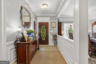 Welcome to this stunning four-sided brick lakefront retreat - photo 6