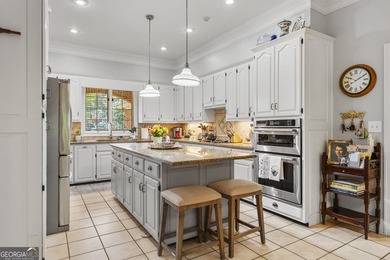 Welcome to this stunning four-sided brick lakefront retreat - photo 8
