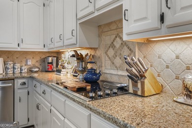 Welcome to this stunning four-sided brick lakefront retreat - photo 9