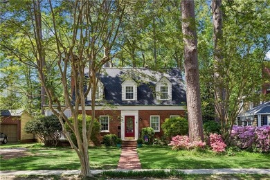 Nestled on a picturesque, wooded lot, this charming Cape Cod is - photo 1