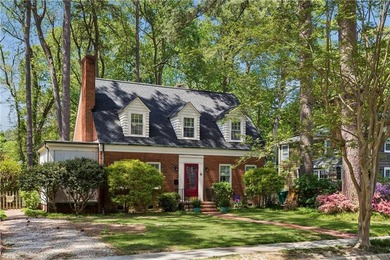Nestled on a picturesque, wooded lot, this charming Cape Cod is - photo 2