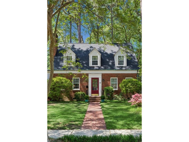 Nestled on a picturesque, wooded lot, this charming Cape Cod is - photo 3