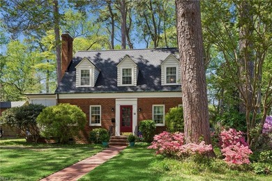 Nestled on a picturesque, wooded lot, this charming Cape Cod is - photo 4