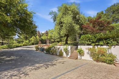 Welcome to 18803 Hilltop Way, a private gated estate nestled in - photo 40