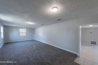 This home offers: 4/2, concrete block construction, ceramic tile - photo 5