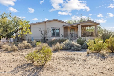 Nestled on over four acres of peaceful desert landscape, this